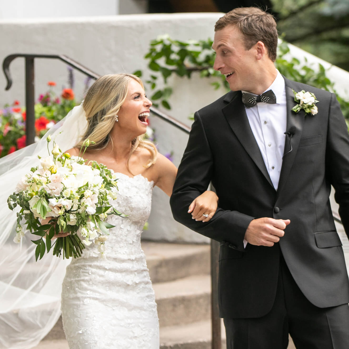Bride and groom walking arm and arm after ceremony
