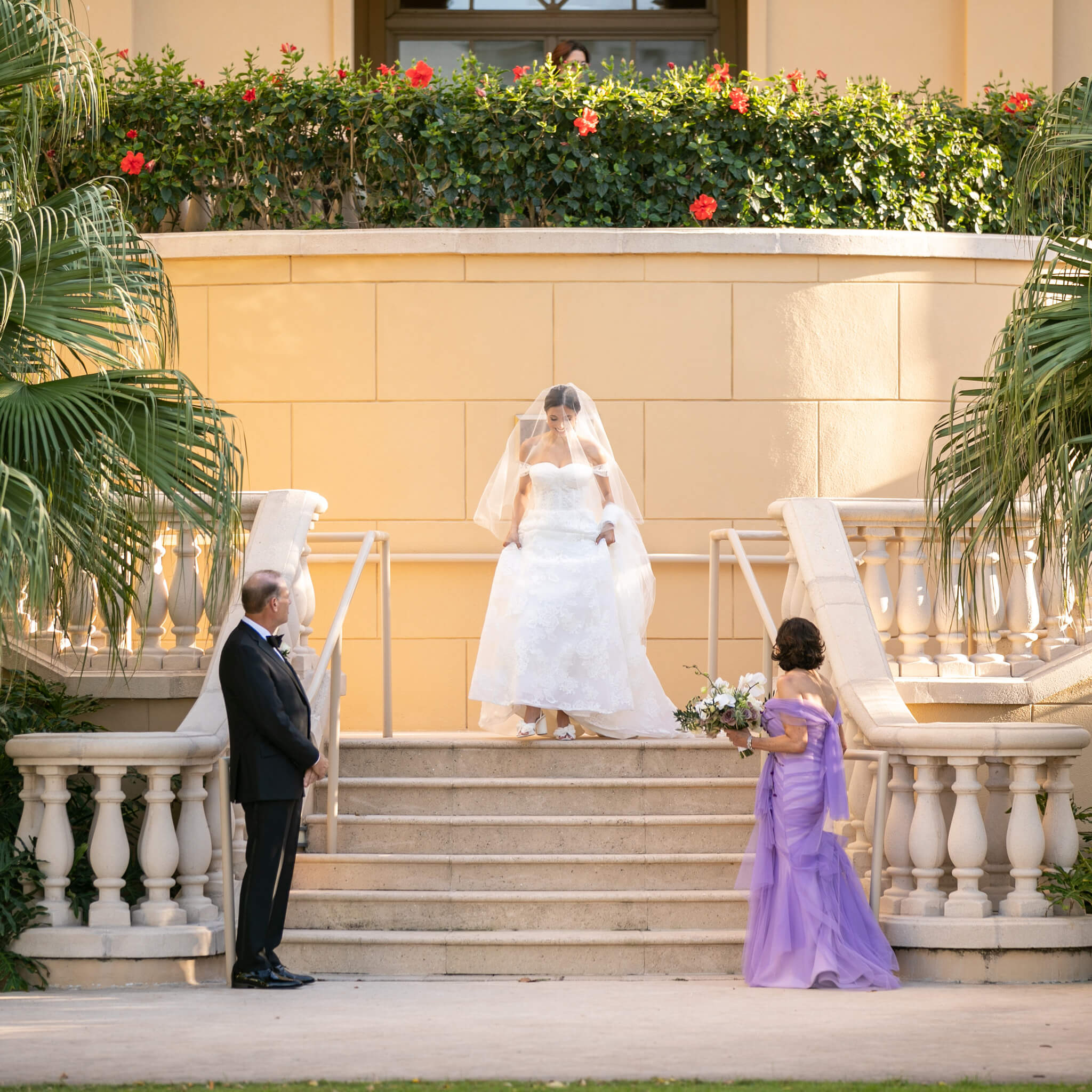 Bride walking down an outdoor stone staircase